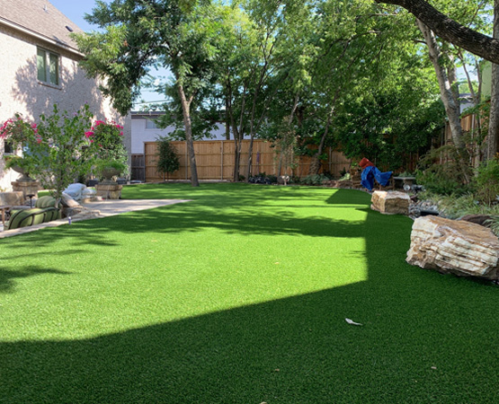 Artificial grass lawn installed in a residential background