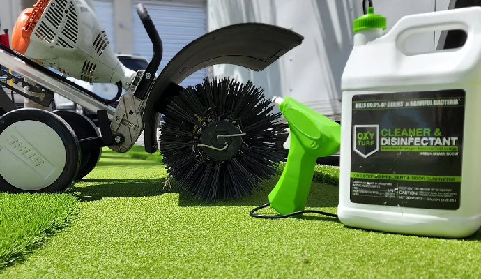 Artificial turf cleaning equipment with power brush and disinfectant spray on synthetic grass