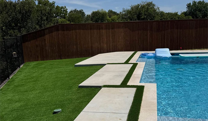 Well-maintained artificial turf around pool